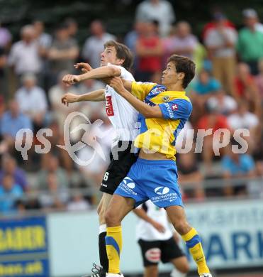 Fussball. Erste Liga. WAC/St. Andrae gegen Vienna FC. Christian Falk,  (WAC), Marcel Toth (Vienna).  Wolfsberg, 23.7.2010. 
Foto: Kuess

---
pressefotos, pressefotografie, kuess, qs, qspictures, sport, bild, bilder, bilddatenbank