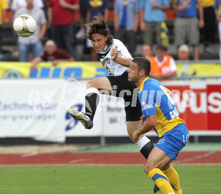 Fussball. Erste Liga. WAC/St. Andrae gegen Vienna FC. Christian Falk (WAC), Marco Salvatore (Vienna).  Wolfsberg, 23.7.2010. 
Foto: Kuess

---
pressefotos, pressefotografie, kuess, qs, qspictures, sport, bild, bilder, bilddatenbank