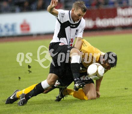 Fussball. Erste Liga. WAC/St. Andrae gegen SCR Altach. Kerhe Manuel (WAC), Suppan Gernot (Altach).  Wolfsberg, 6.8.2010. 
Foto: Kuess

---
pressefotos, pressefotografie, kuess, qs, qspictures, sport, bild, bilder, bilddatenbank