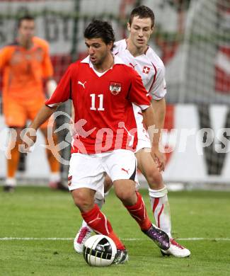 Fussball. Freundschaftsspiel. Oesterreich gegen Schweiz. Uemit Korkmaz, (Oesterreich), Francois Affolter (Schweiz). Klagenfurt, 11.8.2010. 
Foto: Kuess

---
pressefotos, pressefotografie, kuess, qs, qspictures, sport, bild, bilder, bilddatenbank