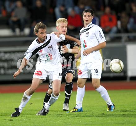 Fussball. Erste Liga. RZ Pellets WAC/St. Andrae gegen TSV Sparkasse Hartberg. Gernot Messner, Roland Putsche, (WAC), Thomas Hopfer (Hartberg). Wolfsberg, 10.9.2010. 
Foto: Kuess

---
pressefotos, pressefotografie, kuess, qs, qspictures, sport, bild, bilder, bilddatenbank