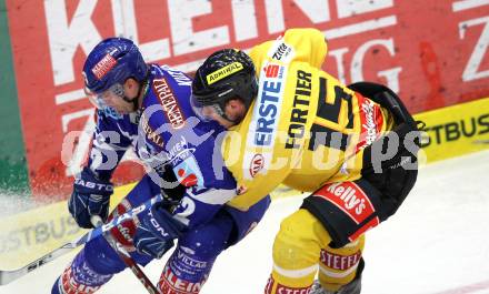 EBEL. Eishockey Bundesliga. EC Rekordfenster VSV gegen Vienna Capitals. Greg Kuznik, (VSV), Francois Fortier (Vienna). Villach, am 4.1.2011.
Foto: Kuess

---
pressefotos, pressefotografie, kuess, qs, qspictures, sport, bild, bilder, bilddatenbank