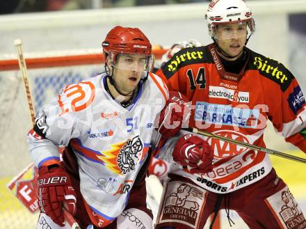 EBEL. Eishockey Bundesliga. EC KAC gegen HK Acroni Jesenice. Johannes Reichel, (KAC), Mitja Robar (Jesenice). Klagenfurt, am 9.1.2011.
Foto: Kuess 

---
pressefotos, pressefotografie, kuess, qs, qspictures, sport, bild, bilder, bilddatenbank