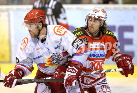 EBEL. Eishockey Bundesliga. EC KAC gegen HK Acroni Jesenice. Martin Schumnig, (KAC), Jason Beckett (Jesenice). Klagenfurt, am 9.1.2011.
Foto: Kuess 

---
pressefotos, pressefotografie, kuess, qs, qspictures, sport, bild, bilder, bilddatenbank