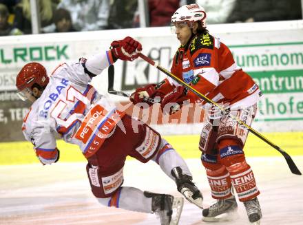 EBEL. Eishockey Bundesliga. EC KAC gegen HK Acroni Jesenice. Dieter Kalt, (KAC), Mitja Robar (Jesenice). Klagenfurt, am 9.1.2011.
Foto: Kuess 

---
pressefotos, pressefotografie, kuess, qs, qspictures, sport, bild, bilder, bilddatenbank