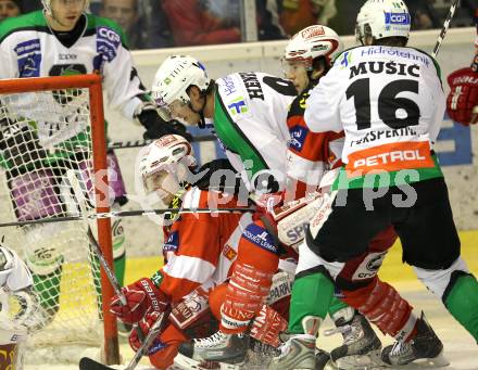 EBEL. Eishockey Bundesliga. EC KAC gegen HDD TILIA Olimpija Ljubljana. Tyler Scofield, Tyler Spurgeon, (KAC), Burke Henry, Ales Music (Laibach). Klagenfurt, am 16.1.2011.
Foto: Kuess 

---
pressefotos, pressefotografie, kuess, qs, qspictures, sport, bild, bilder, bilddatenbank