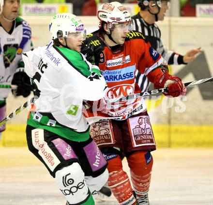 EBEL. Eishockey Bundesliga. EC KAC gegen HDD TILIA Olimpija Ljubljana. Tyler Spurgeon, (KAC), Ales Music (Laibach). Klagenfurt, am 16.1.2011.
Foto: Kuess 

---
pressefotos, pressefotografie, kuess, qs, qspictures, sport, bild, bilder, bilddatenbank