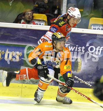 EBEL. Eishockey Bundesliga. KAC gegen Graz 99ers. Stefan Geier,  (KAC), Harry Lange (Graz). Klagenfurt, am 25.1.2011.
Foto: Kuess 

---
pressefotos, pressefotografie, kuess, qs, qspictures, sport, bild, bilder, bilddatenbank