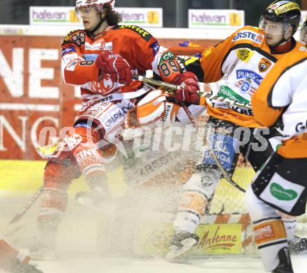 EBEL. Eishockey Bundesliga. KAC gegen Graz 99ers. Raphael Herburger,  (KAC), Robert Lembacher (Graz). Klagenfurt, am 25.1.2011.
Foto: Kuess 

---
pressefotos, pressefotografie, kuess, qs, qspictures, sport, bild, bilder, bilddatenbank