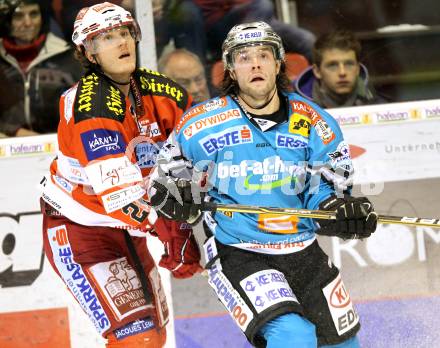 EBEL. Eishockey Bundesliga. KAC gegen EHC LIWEST BLACK WINGS LINZ. Manuel Geier, (KAC), Justin Keller (Linz). Klagenfurt, am 28.1.2011.
Foto: Kuess 

---
pressefotos, pressefotografie, kuess, qs, qspictures, sport, bild, bilder, bilddatenbank