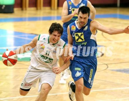 Basketball Bundesliga.  Woerthersee Piraten gegen UBSC Raiffeisen Graz.  Andreas Kuttnig,  (Piraten), Samo Grum (Graz). Klagenfurt, 12.2.2011
Foto:  Kuess

---
pressefotos, pressefotografie, kuess, qs, qspictures, sport, bild, bilder, bilddatenbank