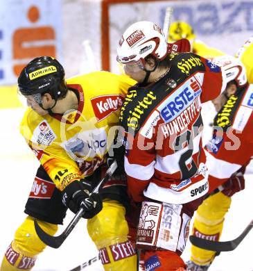 EBEL. Eishockey Bundesliga. KAC gegen EV Vienna Capitals. Thomas HUndertpfund, (KAC),  Philipp Pinter (Vienna). Klagenfurt, am 13.2.2011.
Foto: Kuess 

---
pressefotos, pressefotografie, kuess, qs, qspictures, sport, bild, bilder, bilddatenbank