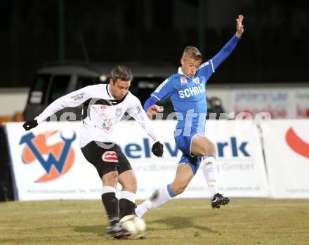 Fussball Erste Liga. WAC/St. Andrae gegen SV Groedig. Marco Reich, (WAC), Martin Grasegger  (Groedig). Wolfsberg, 25.2.2011
Foto: Kuess

---
pressefotos, pressefotografie, kuess, qs, qspictures, sport, bild, bilder, bilddatenbank