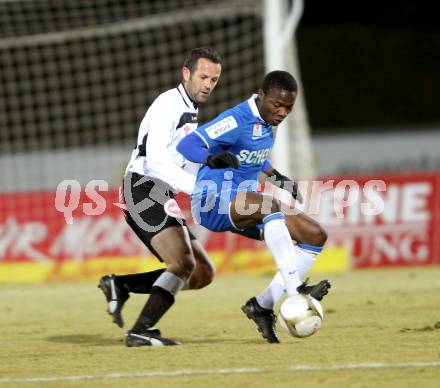 Fussball Erste Liga. WAC/St. Andrae gegen SV Groedig. Hannes Jochum,  (WAC), Issiaka Ouedraogu (Groedig). Wolfsberg, 25.2.2011
Foto: Kuess

---
pressefotos, pressefotografie, kuess, qs, qspictures, sport, bild, bilder, bilddatenbank