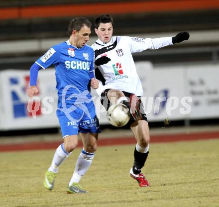 Fussball Erste Liga. WAC/St. Andrae gegen SV Groedig. Roland Putsche,  (WAC), Mersudin Jukic (Groedig). Wolfsberg, 25.2.2011
Foto: Kuess

---
pressefotos, pressefotografie, kuess, qs, qspictures, sport, bild, bilder, bilddatenbank