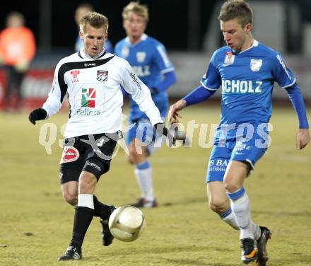 Fussball Erste Liga. WAC/St. Andrae gegen SV Groedig. Manuel Kerhe,  (WAC), Daniel Pirker (Groedig). Wolfsberg, 25.2.2011
Foto: Kuess

---
pressefotos, pressefotografie, kuess, qs, qspictures, sport, bild, bilder, bilddatenbank