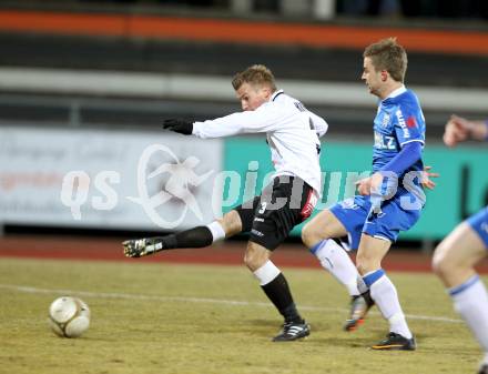 Fussball Erste Liga. WAC/St. Andrae gegen SV Groedig. Manuel Kerhe, (WAC), Daniel Pirker (Groedig). Wolfsberg, 25.2.2011
Foto: Kuess

---
pressefotos, pressefotografie, kuess, qs, qspictures, sport, bild, bilder, bilddatenbank