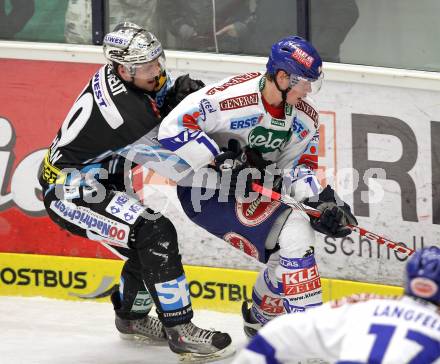 EBEL. Eishockey Bundesliga. EC  VSV gegen EHC LIWEST Linz.  Michael Raffl, (VSV), CASHMAN Reid (Linz). Villach, am 27.2.2011.
Foto: Kuess 


---
pressefotos, pressefotografie, kuess, qs, qspictures, sport, bild, bilder, bilddatenbank