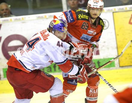 EBEL. Eishockey Bundesliga. KAC gegen Red Bull Salzburg. Raphael Herburger, (KAC), Douglas Lynch (Salzburg). Klagenfurt, am 10.4.2011.
Foto: Kuess 

---
pressefotos, pressefotografie, kuess, qs, qspictures, sport, bild, bilder, bilddatenbank