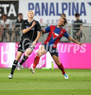 Fussball. UEFA Champions League. SK Sturm Graz gegen Videoton. Matthias Koch, (Graz), Attila Polonkai (Videoton). Klagenfurt, am 13.7.2011.
Foto: Kuess

---
pressefotos, pressefotografie, kuess, qs, qspictures, sport, bild, bilder, bilddatenbank