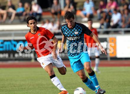 Fussball Testspiel. PSV Eindhoven gegen CF Valencia. Kevon Strootman (Eindhoven), Topal  (Valencia). Wolfsberg, am 19.7.2011.
Foto: Kuess
---
pressefotos, pressefotografie, kuess, qs, qspictures, sport, bild, bilder, bilddatenbank