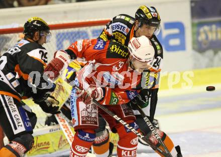 EBEL. Eishockey Bundesliga.  KAC gegen Graz 99ers. GEIER Stefan (KAC), REINTHALER Kristof (Graz). Klagenfurt, 23.9.2011.
Foto: Kuess 

---
pressefotos, pressefotografie, kuess, qs, qspictures, sport, bild, bilder, bilddatenbank