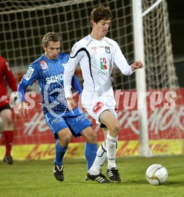 Fussball. Erste Liga. RZ Pellets WAC/St. Andrae gegen SV Groedig. Christian Falk,  (WAC), Peter Riedl (Groedig). Wolfsberg, 25.11.2011. 
Foto: Kuess

---
pressefotos, pressefotografie, kuess, qs, qspictures, sport, bild, bilder, bilddatenbank