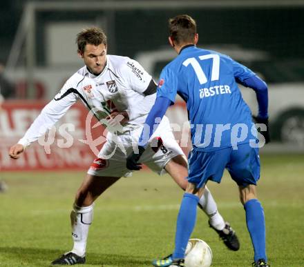 Fussball. Erste Liga. RZ Pellets WAC/St. Andrae gegen SV Groedig. Gernot Messner, (WAC), Ernst Oebster (Groedig). Wolfsberg, 25.11.2011. 
Foto: Kuess

---
pressefotos, pressefotografie, kuess, qs, qspictures, sport, bild, bilder, bilddatenbank