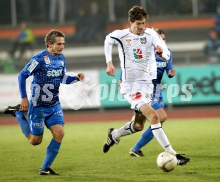 Fussball. Erste Liga. RZ Pellets WAC/St. Andrae gegen SV Groedig. Christian Falk, (WAC), Peter Riedl (Groedig). Wolfsberg, 25.11.2011. 
Foto: Kuess

---
pressefotos, pressefotografie, kuess, qs, qspictures, sport, bild, bilder, bilddatenbank