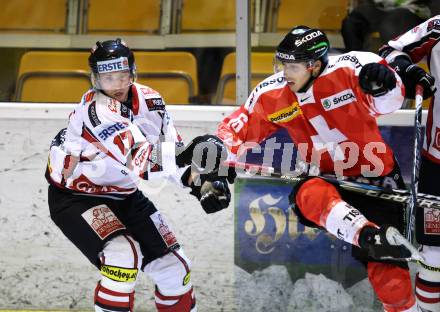 Eishockey Oesterreich Cup. Oesterreich gegen Schweiz.  Johannes Reichel, (Oesterreich), Inti Pestoni  (Schweiz). Klagenfurt, 16.12.2011.
Foto: Kuess

---
pressefotos, pressefotografie, kuess, qs, qspictures, sport, bild, bilder, bilddatenbank