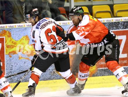 Eishockey Oesterreich Cup. Oesterreich gegen Schweiz.  Dominique Heinrich, (Oesterreich), Goran Bezina (Schweiz). Klagenfurt, 16.12.2011.
Foto: Kuess

---
pressefotos, pressefotografie, kuess, qs, qspictures, sport, bild, bilder, bilddatenbank