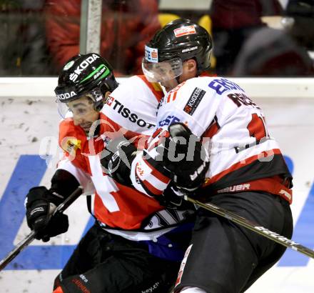 Eishockey Oesterreich Cup. Oesterreich gegen Schweiz. Johannes Reichel,  (Oesterreich), Andreas Ambuehl (Schweiz). Klagenfurt, 16.12.2011.
Foto: Kuess

---
pressefotos, pressefotografie, kuess, qs, qspictures, sport, bild, bilder, bilddatenbank