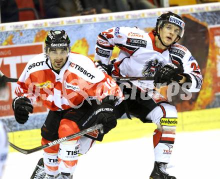 Eishockey Oesterreich Cup. Oesterreich gegen Schweiz. Daniel Woger,  (Oesterreich), Andreas Ambuehl (Schweiz). Klagenfurt, 16.12.2011.
Foto: Kuess

---
pressefotos, pressefotografie, kuess, qs, qspictures, sport, bild, bilder, bilddatenbank