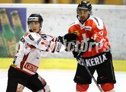 Eishockey Oesterreich Cup. Oesterreich gegen Schweiz. Daniel Oberkofler, (Oesterreich), Andreas Ambuehl  (Schweiz). Klagenfurt, 16.12.2011.
Foto: Kuess

---
pressefotos, pressefotografie, kuess, qs, qspictures, sport, bild, bilder, bilddatenbank