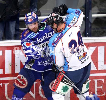 EBEL. Eishockey Bundesliga. EC Rekord Fenster VSV gegen SAPA Fehervar AV19. Kevin Mitchell,  (VSV), Krisztian Palkovics (Alba Volan). Villach, am 1.1.2012.
Foto: Kuess 


---
pressefotos, pressefotografie, kuess, qs, qspictures, sport, bild, bilder, bilddatenbank