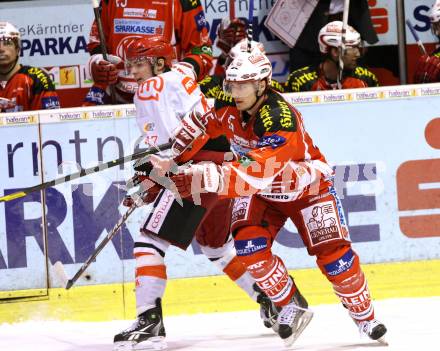 EBEL. Eishockey Bundesliga. KAC gegen HK Acroni Jesenice. SCHULLER David (KAC), ERMAN Matevz (Jesenice). Klagenfurt, am 6.1.2012.
Foto: Kuess

---
pressefotos, pressefotografie, kuess, qs, qspictures, sport, bild, bilder, bilddatenbank