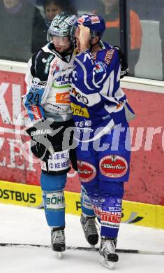 EBEL. Eishockey Bundesliga. EC Rekord Fenster VSV gegen EHC LIWEST BLACK WINGS LINZ. KUZNIK Greg (VSV), VEIDEMAN Adrian (Linz). Villach, am 13.1.2012.
Foto: Kuess 


---
pressefotos, pressefotografie, kuess, qs, qspictures, sport, bild, bilder, bilddatenbank