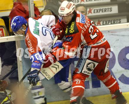 EBEL. Eishockey Bundesliga. KAC gegen Medvescak Zagreb. Thomas HUndertpfund (KAC), Gal Koren (Zagreb). Klagenfurt, am 24.1.2012.
Foto: Kuess

---
pressefotos, pressefotografie, kuess, qs, qspictures, sport, bild, bilder, bilddatenbank