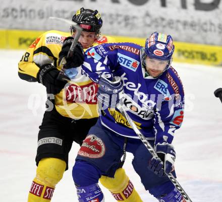 EBEL. Eishockey Bundesliga. EC Rekord Fenster VSV gegen UPC Vienna Capitals. Kevin Mitchell,  (VSV), Filip Gunnarsson (Caps). Villach, am 27.1.2012.
Foto: Kuess 


---
pressefotos, pressefotografie, kuess, qs, qspictures, sport, bild, bilder, bilddatenbank