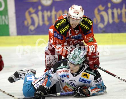 EBEL. Eishockey Bundesliga. KAC gegen EHC LIWEST Linz. Tyler Scofield,,  (KAC), Danny Irmen (Linz). Klagenfurt, am 29.1.2012.
Foto: Kuess

---
pressefotos, pressefotografie, kuess, qs, qspictures, sport, bild, bilder, bilddatenbank