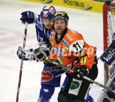 EBEL. Eishockey Bundesliga. EC Rekord Fenster VSV gegen Graz 99ers.  Stefan Bacher (VSV),  Brett Lysak (Graz). Villach, am 14.2.2012.
Foto: Kuess 


---
pressefotos, pressefotografie, kuess, qs, qspictures, sport, bild, bilder, bilddatenbank