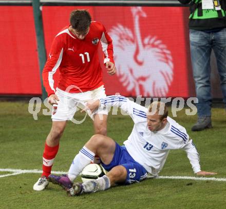 Fussball Laenderspiel. Oesterreich gegen Finnland. Martin Harnik,  (Oesterreich), Kari Arkivuo (Finnland). Klagenfurt Woerthersee Stadion, 29.2.2012.
Foto: Kuess

---
pressefotos, pressefotografie, kuess, qs, qspictures, sport, bild, bilder, bilddatenbank