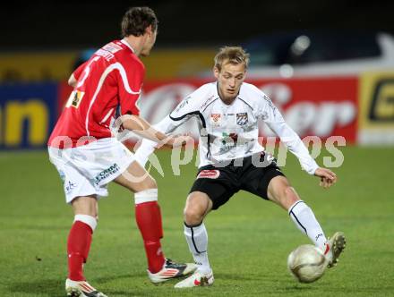 Fussball. Erste Liga.  WAC/St. Andrae gegen SKN St. Poelten. Danijel Micic, (WAC), Stephan Zwierschitz  (St. Poelten). Wolfsberg, 2.4.2012. 
Foto: Kuess

---
pressefotos, pressefotografie, kuess, qs, qspictures, sport, bild, bilder, bilddatenbank