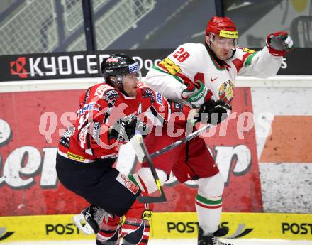Eishockey Laenderspiel. Oesterreich gegen Weissrussland. Matthias Tratnig,  (Oesterreich), Konstantin Koltsov (Weissrussland). Klagenfurt, am 6.4.2012.
Foto: Kuess

---
pressefotos, pressefotografie, kuess, qs, qspictures, sport, bild, bilder, bilddatenbank