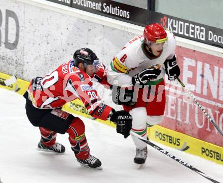 Eishockey Laenderspiel. Oesterreich gegen Weissrussland. Daniel Welser,  (Oesterreich), Yevgeni Nogachyov (Weissrussland). Klagenfurt, am 6.4.2012.
Foto: Kuess

---
pressefotos, pressefotografie, kuess, qs, qspictures, sport, bild, bilder, bilddatenbank