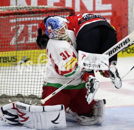 Eishockey Laenderspiel. Oesterreich gegen Weissrussland. Patrick Obrist,   (Oesterreich), Andrei Mezin, (Weissrussland). Klagenfurt, am 6.4.2012.
Foto: Kuess

---
pressefotos, pressefotografie, kuess, qs, qspictures, sport, bild, bilder, bilddatenbank