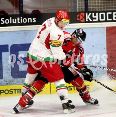 Eishockey Laenderspiel. Oesterreich gegen Weissrussland. Daniel Welser, (Oesterreich), Vladimir Denisov (Weissrussland). Klagenfurt, am 6.4.2012.
Foto: Kuess

---
pressefotos, pressefotografie, kuess, qs, qspictures, sport, bild, bilder, bilddatenbank