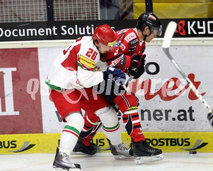 Eishockey Laenderspiel. Oesterreich gegen Weissrussland. Thomas Raffl, (Oesterreich), Andrei Stas (Weissrussland). Klagenfurt, am 6.4.2012.
Foto: Kuess

---
pressefotos, pressefotografie, kuess, qs, qspictures, sport, bild, bilder, bilddatenbank
