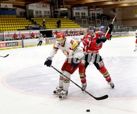 Eishockey Laenderspiel. Oesterreich gegen Weissrussland. Andreas Kristler,  (Oesterreich), Sergei Drozd (Weissrussland). Klagenfurt, am 6.4.2012.
Foto: Kuess

---
pressefotos, pressefotografie, kuess, qs, qspictures, sport, bild, bilder, bilddatenbank
