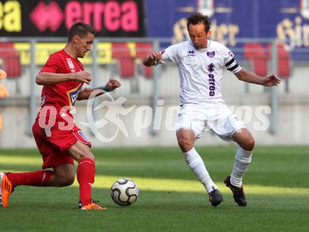 Fussball OEFB Cup. SK Austria Klagenfurt gegen SV Horn. Matthias Dollinger (Austria), Aleksandar Djordjevic (Horn). Klagenfurt, am 13.7.2012.
Foto: Kuess
---
pressefotos, pressefotografie, kuess, qs, qspictures, sport, bild, bilder, bilddatenbank